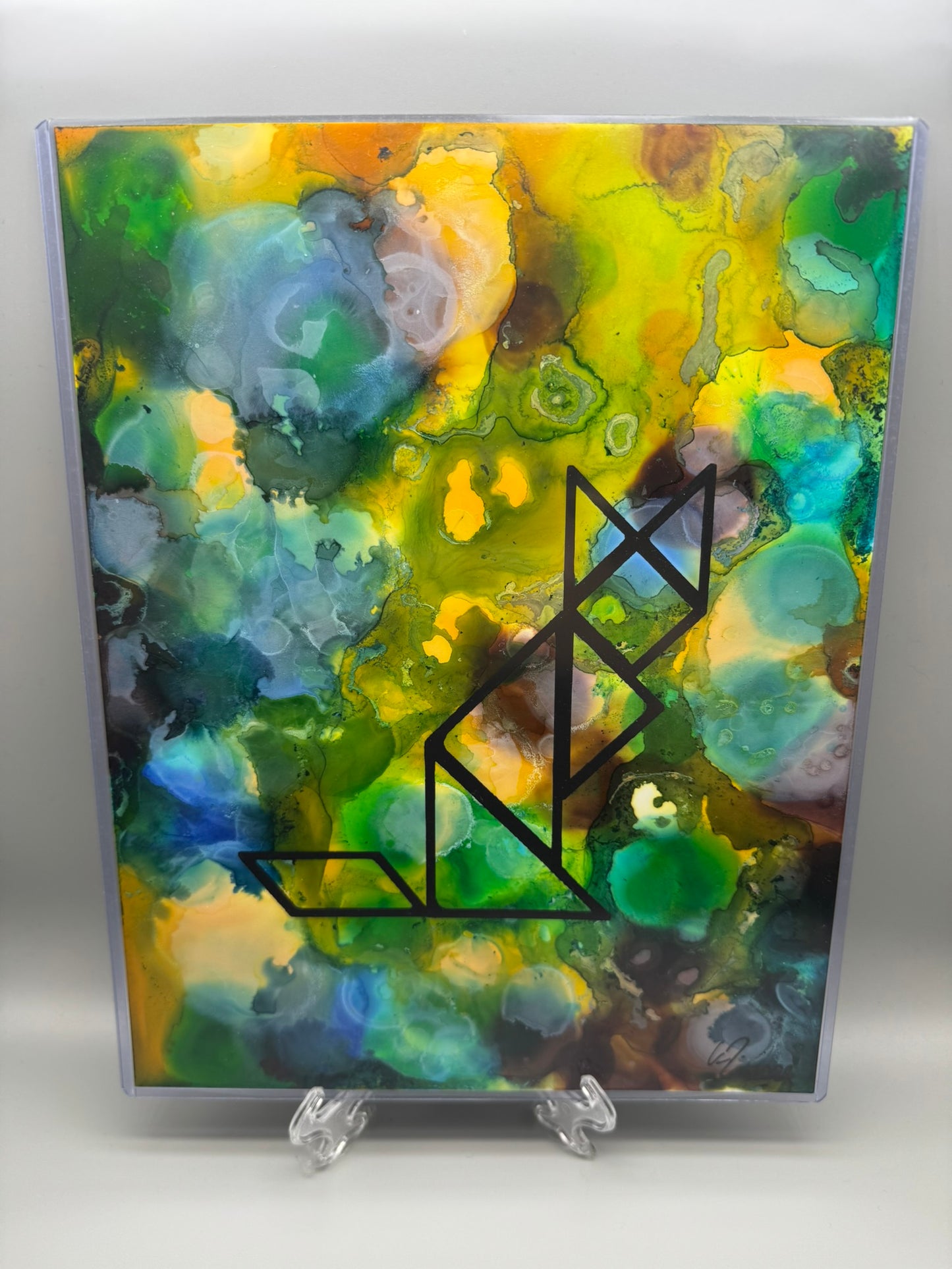 Abstract art piece with geometric design on a colorful background