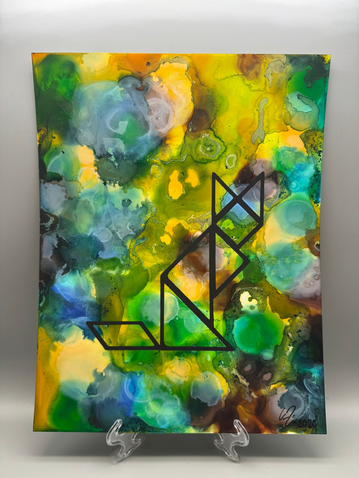 Abstract painting with a black geometric design on a colorful background