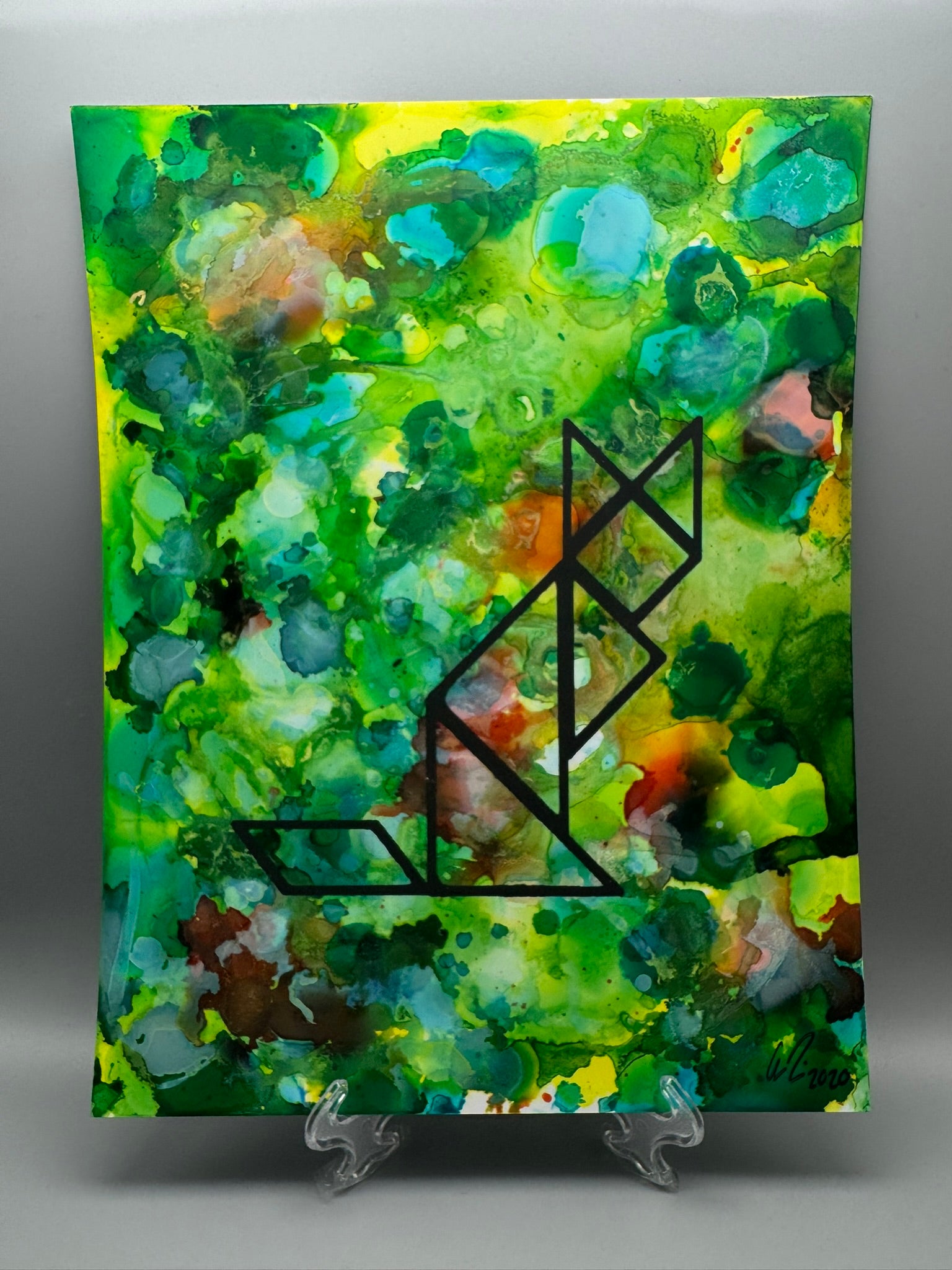 Abstract painting with green and blue colors and a black geometric design on a gray background